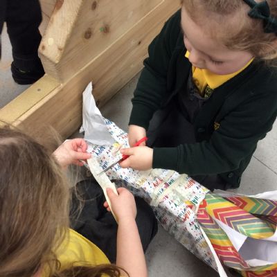 Working together to wrap a present