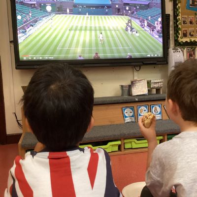 Enjoying watching a game of tennis during our England themed picnic 