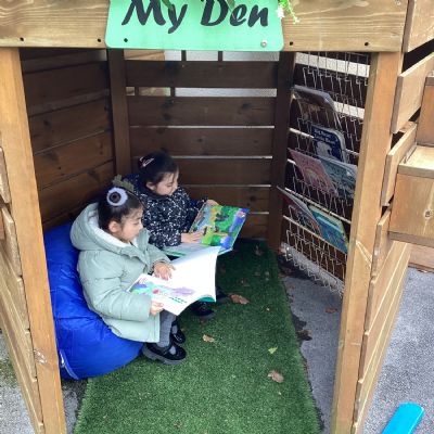 Enjoying a book together outdoors 
